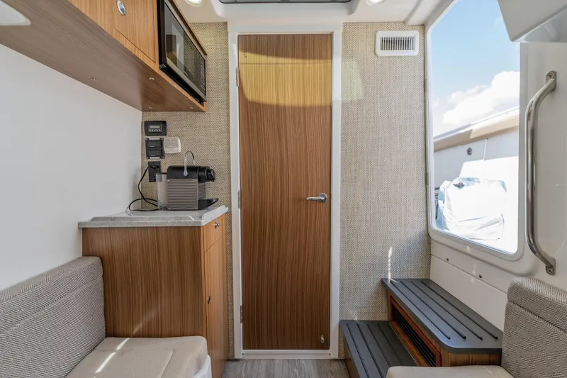Slide: The Image of Interior of 2021 Everglades 395 Center Console boat with modern amenities. - 78