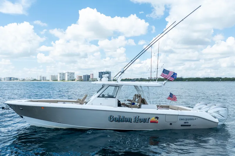 Slide: The Image of 2021 Everglades 395 Center Console boat on water, city skyline in background. - 8