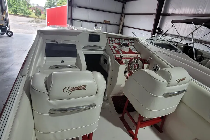 Slide: The Image of 2000 Cigarette 35 Top Gun LE boat interior with white seats and red accents. - 10