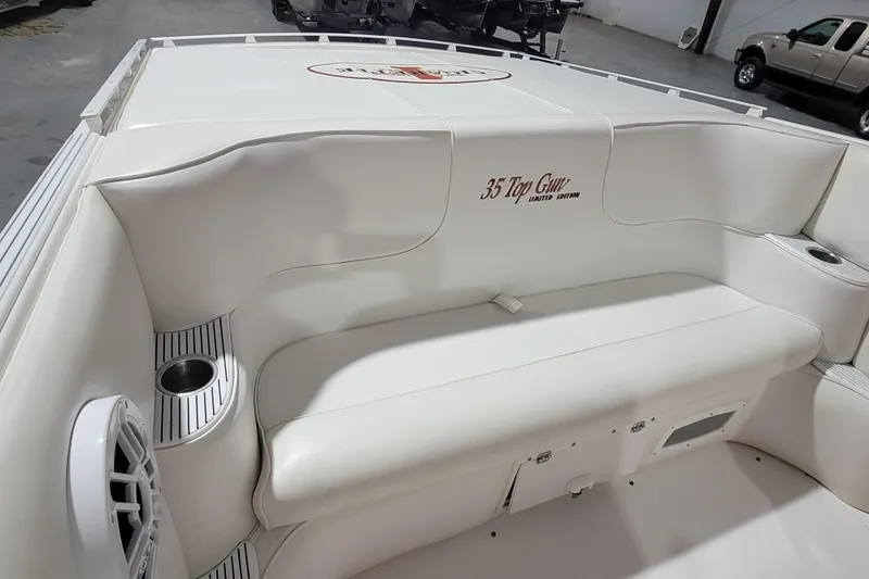 Slide: The Image of 2000 Cigarette 35 Top Gun LE boat interior with white seating and cup holders. - 11