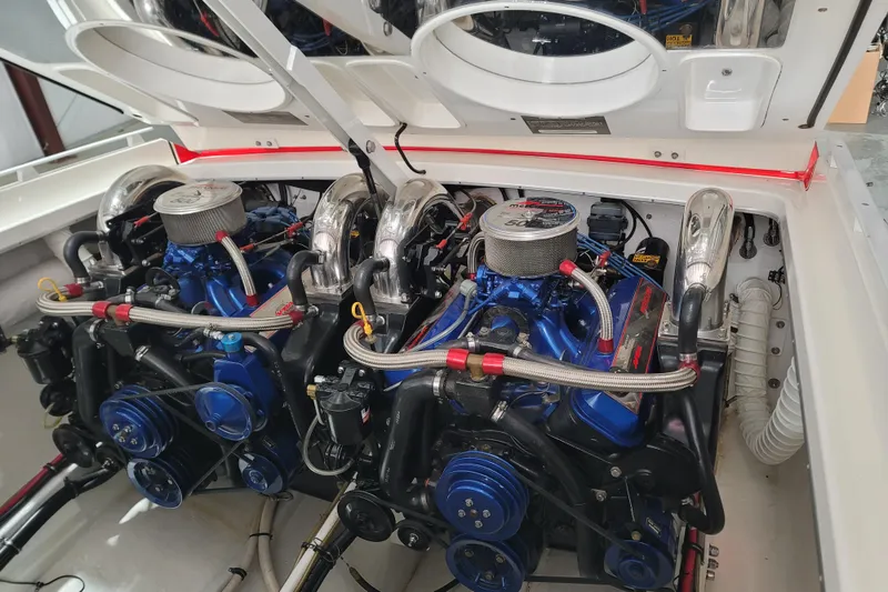 Slide: The Image of Twin engines in a 2000 Cigarette 35 Top Gun LE boat, showcasing detailed mechanics. - 18