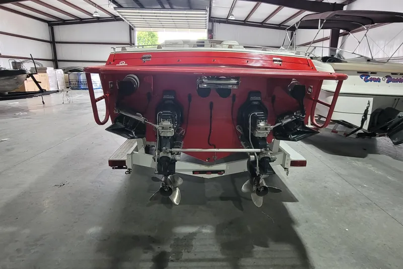 Slide: The Image of Rear view of a 2000 Cigarette 35 Top Gun LE boat in a storage facility. - 4