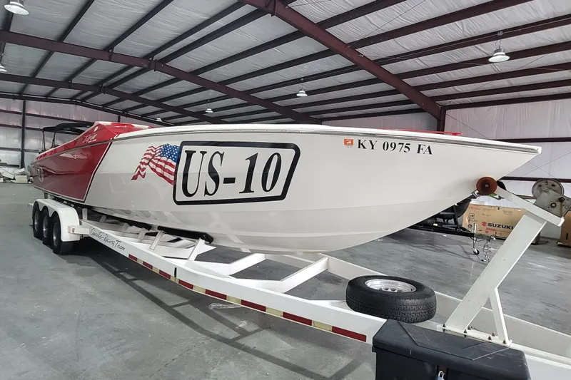 Slide: The Image of 2000 Cigarette 35 Top Gun LE boat in warehouse, on trailer, with US-10 marking. - 8