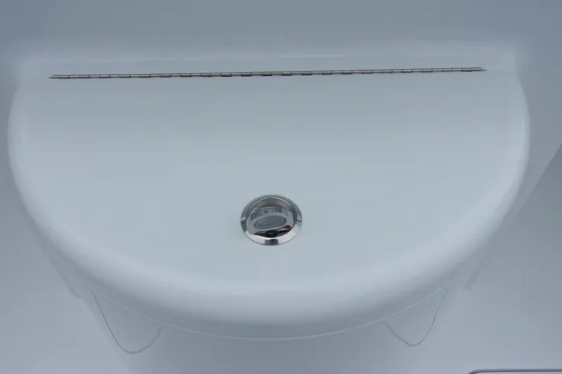 Slide: The Image of 2025 Bluewater 23 T boat deck with sleek white finish and chrome drain. - 16