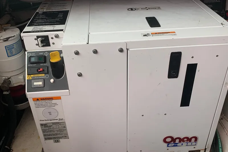 Slide: The Image of Onan generator in a 2008 Back Cove 33 Hard Top Express boat engine room. - 42