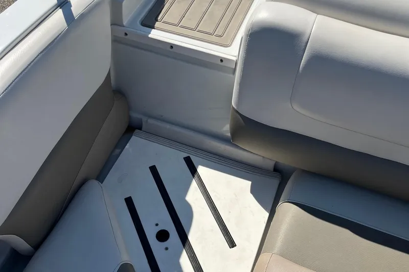 Slide: The Image of 2019 Crownline 205 SS boat interior with cushioned seating and non-slip flooring. - 18