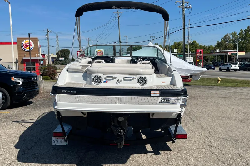 Slide: The Image of 2019 Crownline 205 SS boat parked near a Burger King and gas station. - 3