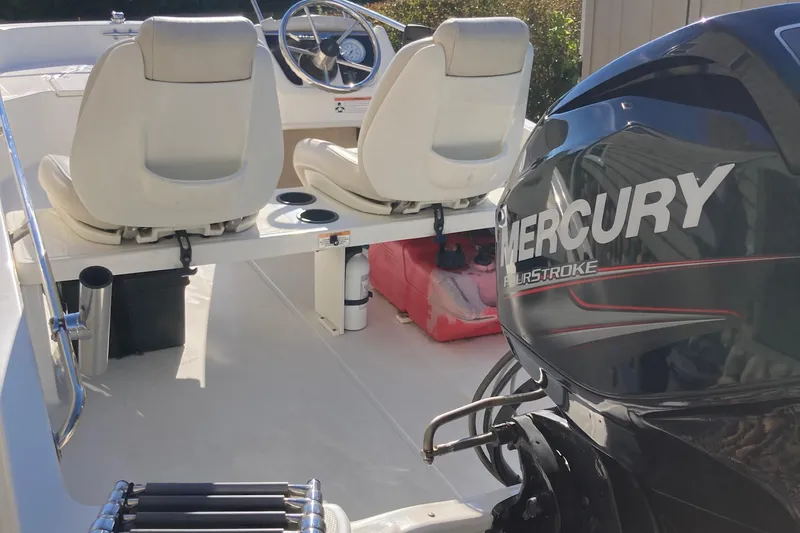 Slide: The Image of 2019 Boston Whaler 130 Super Sport with Mercury FourStroke engine, interior view. - 13