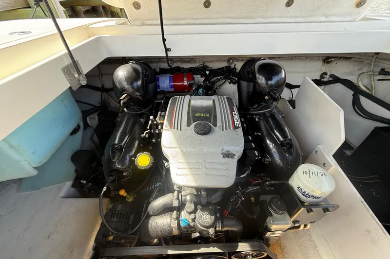Slide: The Image of Engine compartment of a 2014 Sea Ray 260 Sundeck boat, featuring a 350 MAG engine. - 9