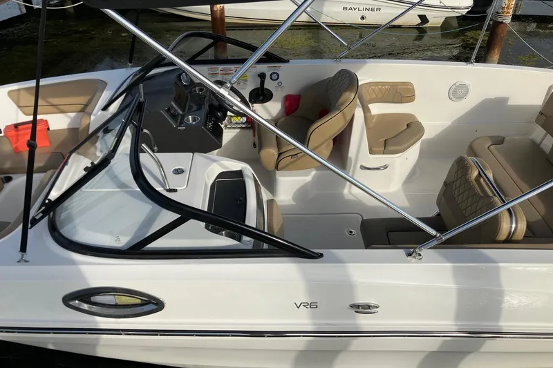 Slide: The Image of 2024 Bayliner VR6 Bowrider OB with beige seating and sleek design. - 3