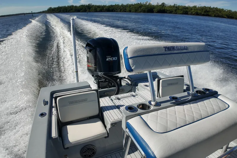Slide: The Image of 2014 Pathfinder 2200 TRS boat cruising on open water, featuring Yamaha 200 engine. - 13