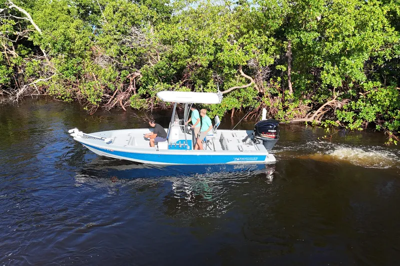 Slide: The Image of 2014 Pathfinder 2200 TRS boat navigating through mangrove-lined waterway. - 17