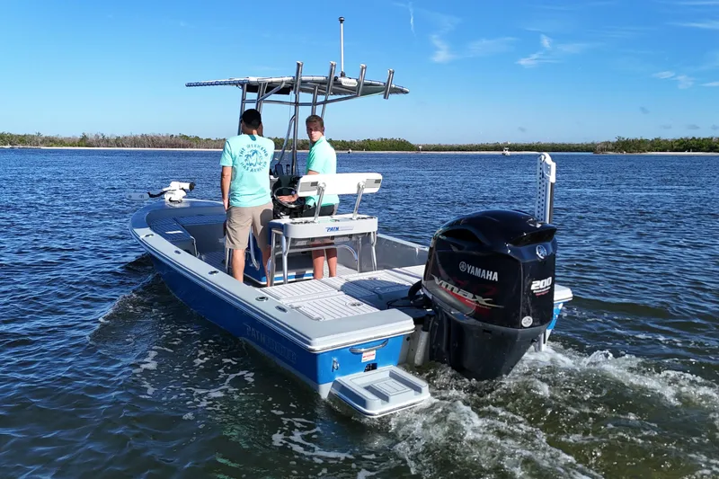 Slide: The Image of 2014 Pathfinder 2200 TRS boat with Yamaha engine on open water. - 4