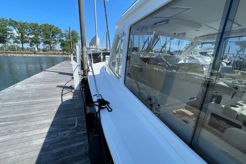 Slide: The Image of 2023 MJM 35 yacht docked at marina, showcasing sleek design and modern features. - 19