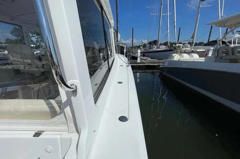 Slide: The Image of 2023 MJM 35 boat with Garmin equipment, docked at a marina. - 20