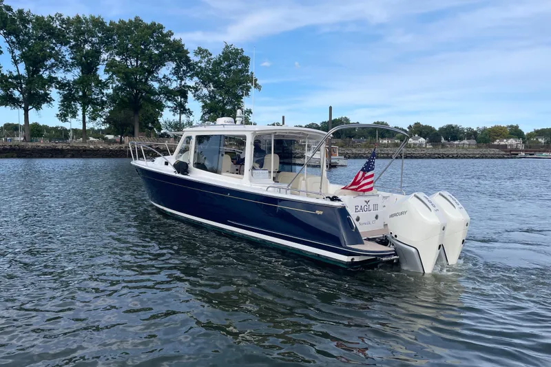 Slide: The Image of Interior of 2023 MJM 35 yacht with luxurious seating and marina view. - 5