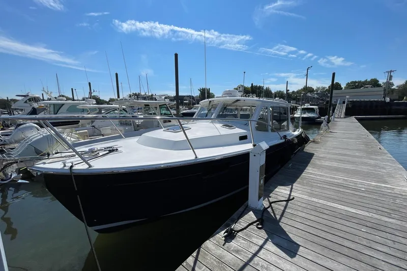 Slide: The Image of Interior of 2023 MJM 35 yacht, featuring helm station and luxurious seating. - 7