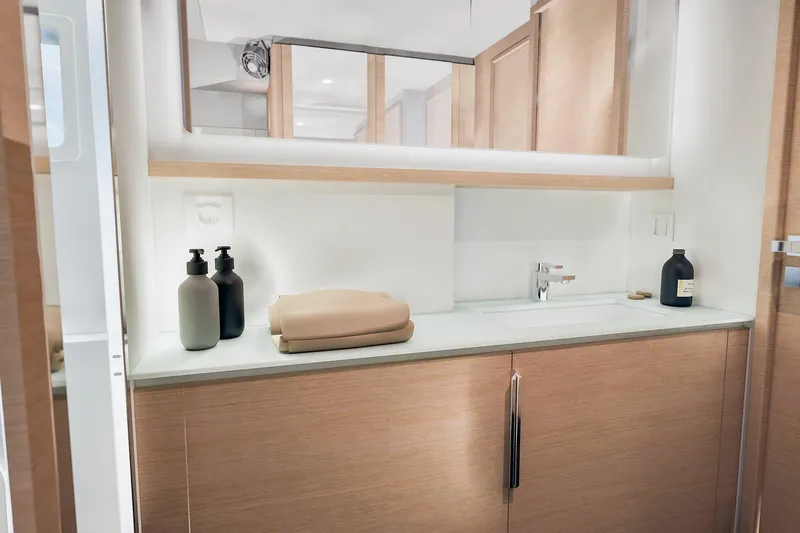 Slide: The Image of Modern bathroom interior on 2026 Fountaine Pajot 55 yacht, featuring sleek cabinetry and elegant fixtures. - 21