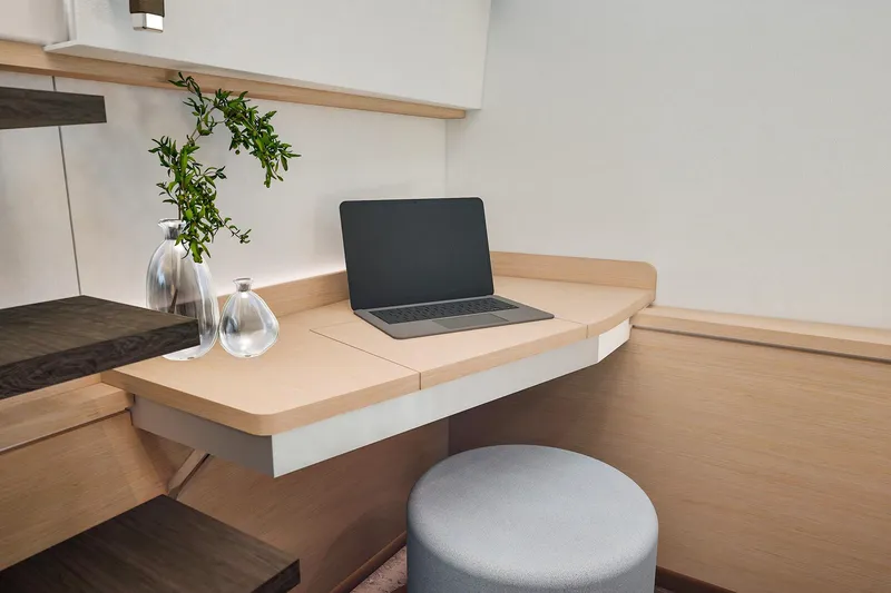 Slide: The Image of Modern workspace on 2026 Fountaine Pajot 55 yacht with laptop and decorative plants. - 25