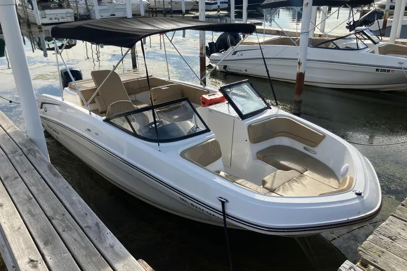 The Image of 2024 Bayliner VR6 Bowrider OB docked, featuring sleek design and spacious seating. - 0