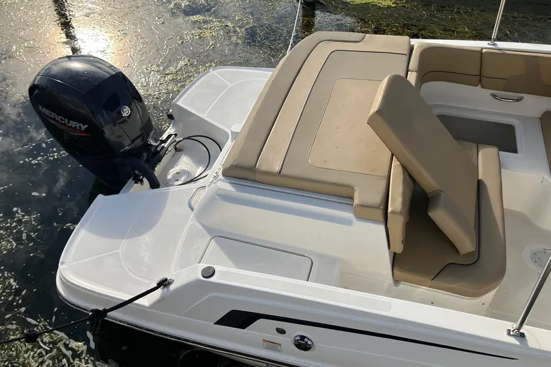 Slide: The Image of 2024 Bayliner VR6 Bowrider OB with Mercury outboard engine, featuring tan seating and sleek design. - 3