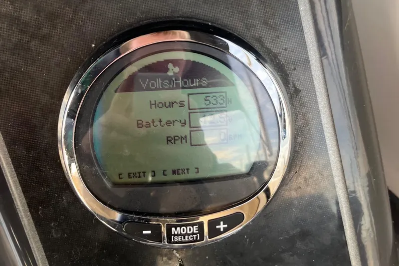 Slide: The Image of Close-up of a 2024 Bayliner VR6 Bowrider OB dashboard display showing hours, battery, and RPM. - 8