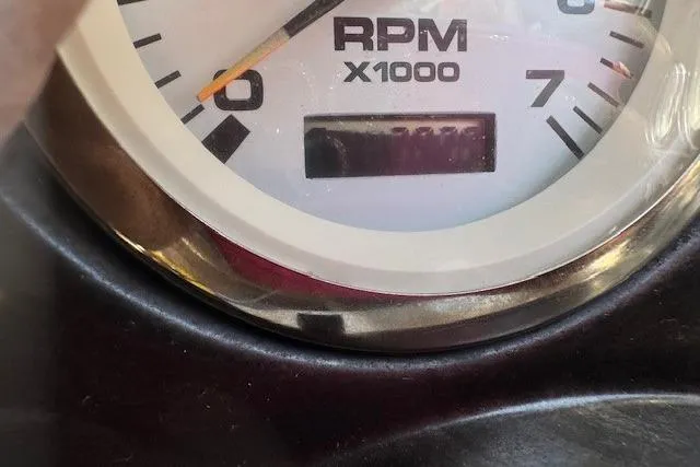 Slide: The Image of Close-up of a 2003 Stingray 180LS RPM gauge, displaying engine revolutions. - 10
