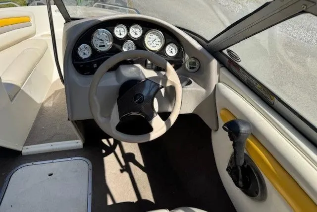 Slide: The Image of 2003 Stingray 180LS boat interior with steering wheel and dashboard gauges. - 4