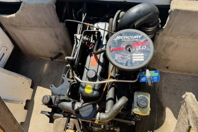Slide: The Image of 2003 Stingray 180LS boat engine, featuring a Mercury MerCruiser 3.0 motor. - 7