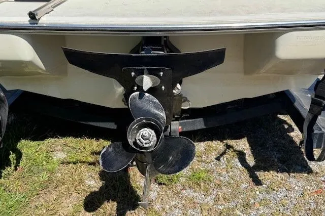 Slide: The Image of 2003 Stingray 180LS boat propeller and stern, displayed on grass. - 9