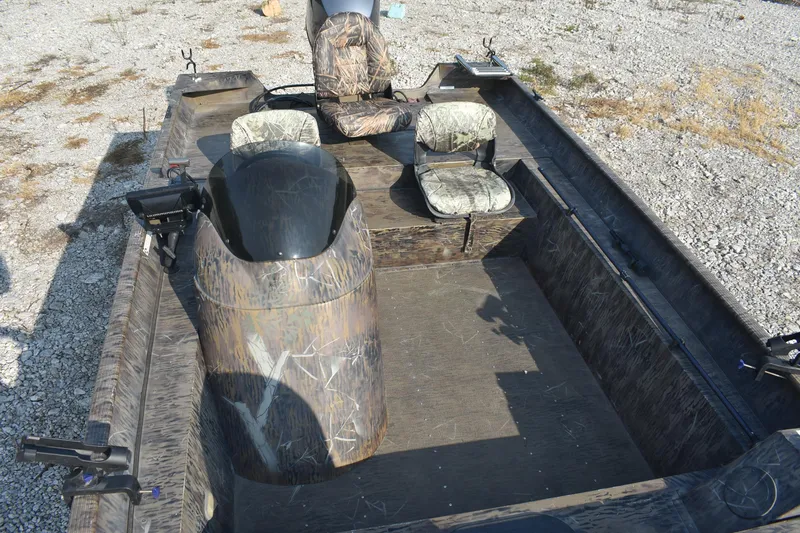 Slide: The Image of 2012 G3 1860 SC CAMO boat interior with camouflage seating and steering console. - 13