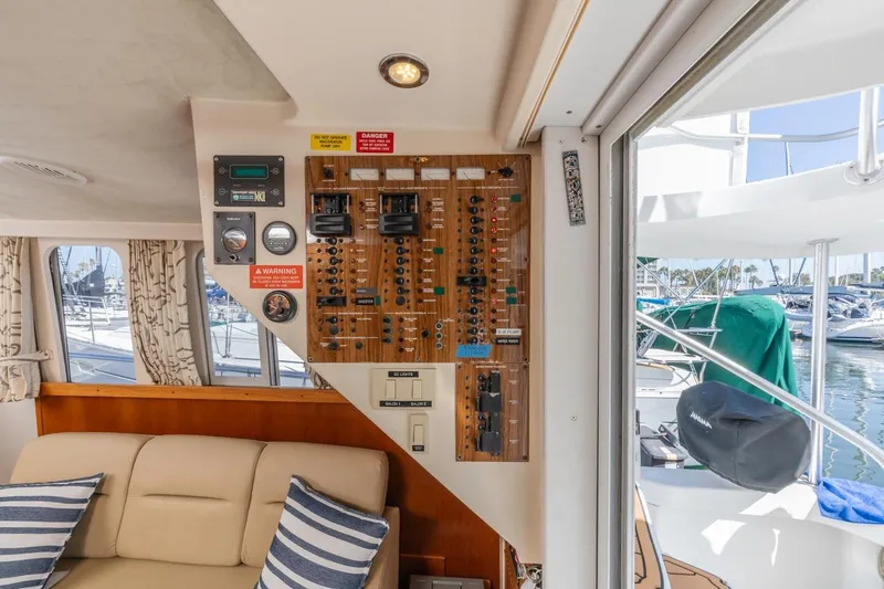 Slide: The Image of Interior of 2001 Mainship 390 Trawler showing control panel and seating area. - 31