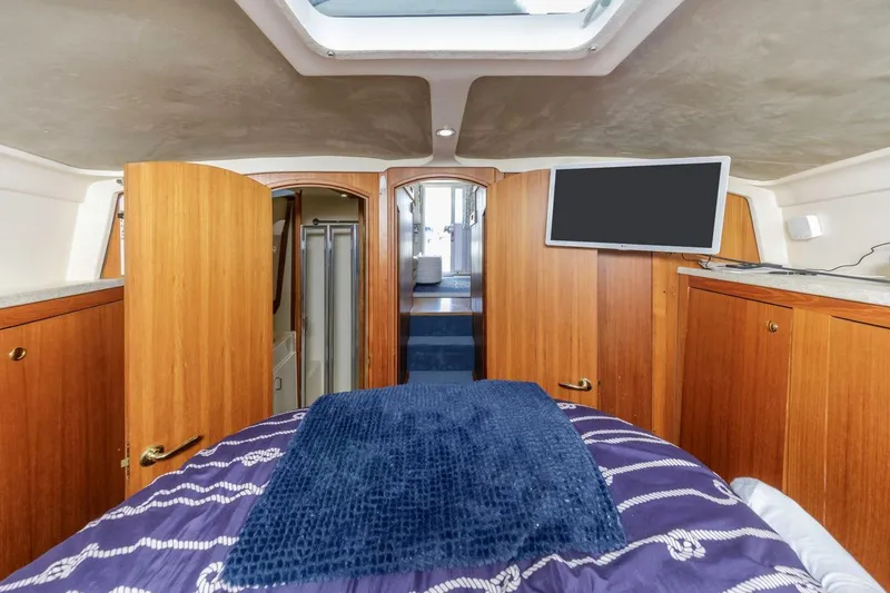 Slide: The Image of Interior of 2001 Mainship 390 Trawler with wood cabinetry and modern amenities. - 34