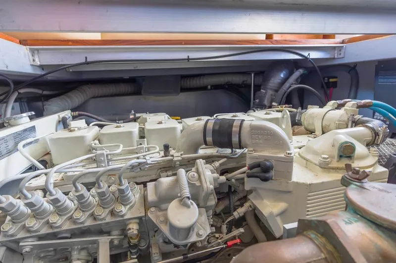 Slide: The Image of Engine room of 2001 Mainship 390 Trawler, showcasing detailed mechanical components. - 40