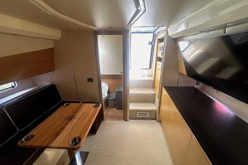 Slide: The Image of Interior of 2013 Azimut Atlantis Verve Outboard with TV and storage cabinets. - 79