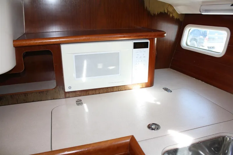 Slide: The Image of Interior of 1999 Beneteau Oceanis 352 yacht with microwave and countertop. - 21