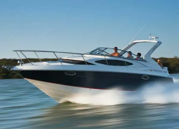 Slide: The Image of Cockpit of 2011 Regal 3060 Express Cruiser with Garmin navigation system. - 2