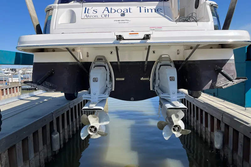 Slide: The Image of Twin Volvo Penta engines in a 2011 Regal 3060 Express Cruiser boat. - 29