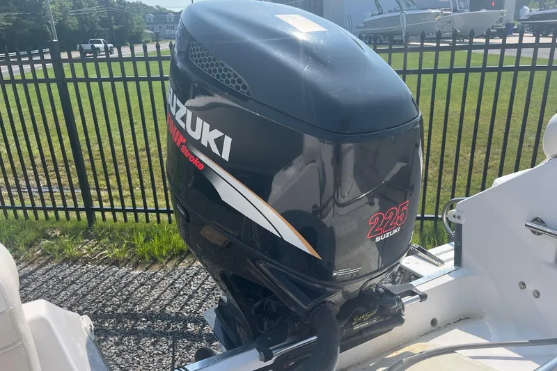Slide: The Image of Outboard motor on a 2006 Seaquest 2200 BW boat, featuring a Suzuki 225 horsepower engine. - 4