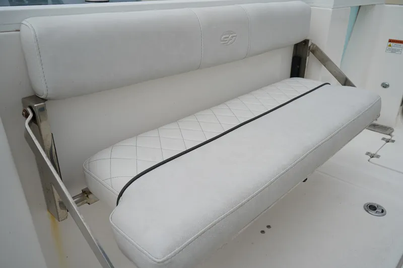 Slide: The Image of 2020 Sea Fox 328 Commander boat seat with white cushioned upholstery. - 12