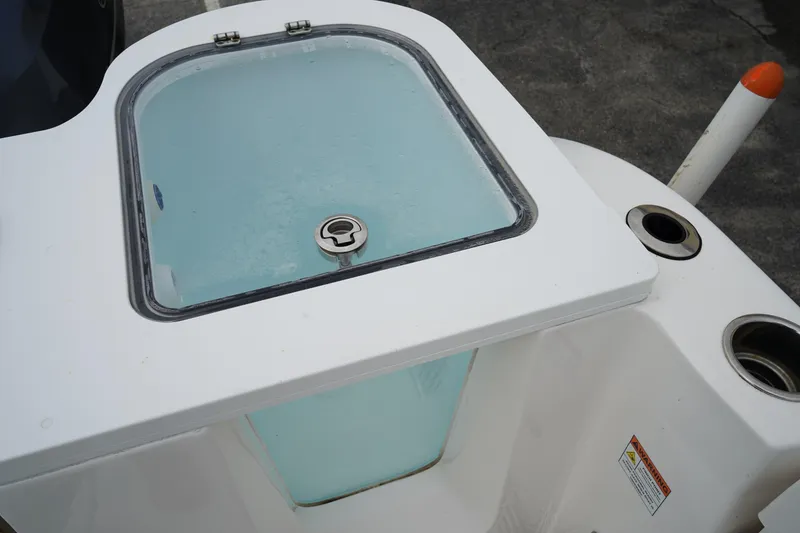 Slide: The Image of Livewell on 2020 Sea Fox 328 Commander boat, featuring a clear lid and secure latch. - 13