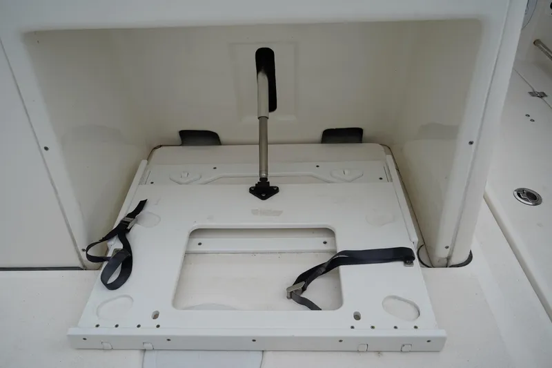 Slide: The Image of 2020 Sea Fox 328 Commander boat storage compartment with securing straps. - 14