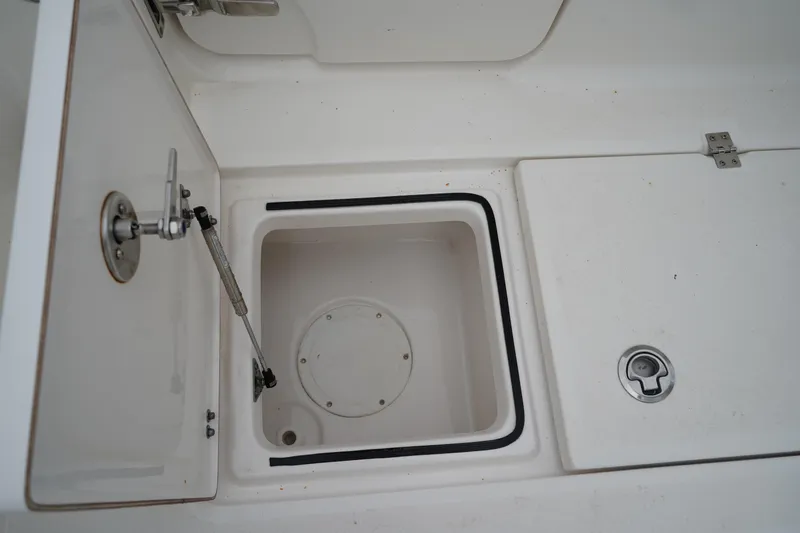 Slide: The Image of Open storage compartment on a 2020 Sea Fox 328 Commander boat. - 19