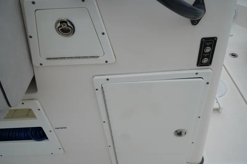 Slide: The Image of 2020 Sea Fox 328 Commander boat interior with storage compartments and control panel. - 23