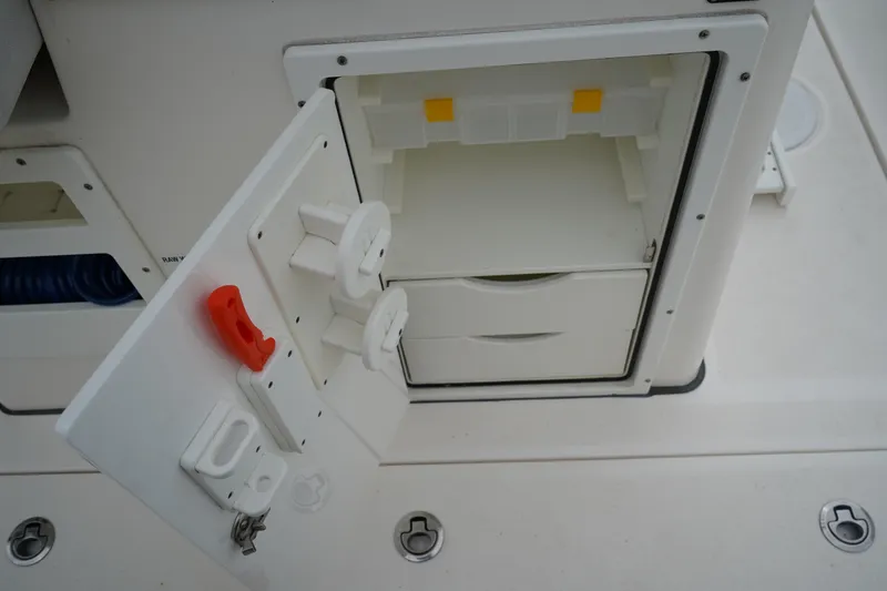 Slide: The Image of Open storage compartment on 2020 Sea Fox 328 Commander boat, featuring drawers and holders. - 24