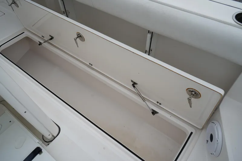 Slide: The Image of Open storage compartment on 2020 Sea Fox 328 Commander boat. - 28