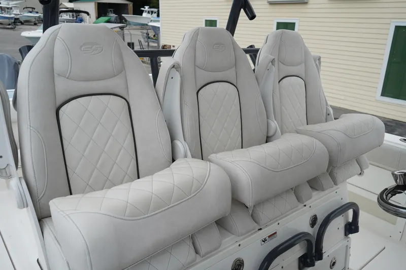 Slide: The Image of Luxury seating on 2020 Sea Fox 328 Commander boat, featuring plush, diamond-stitched upholstery. - 29