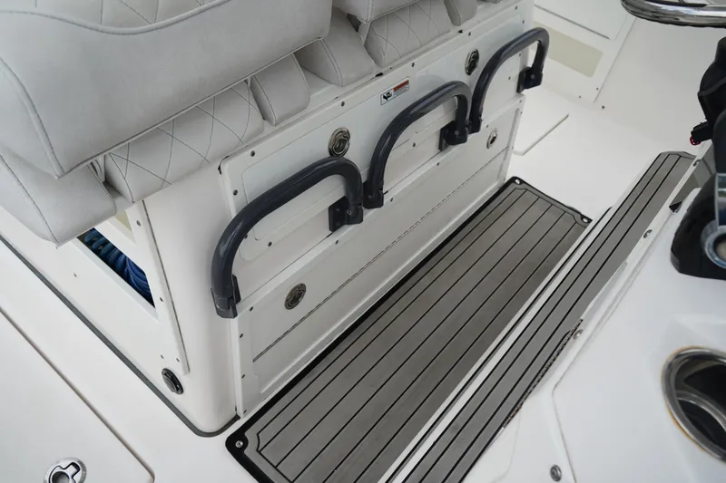 Slide: The Image of 2020 Sea Fox 328 Commander boat interior with cushioned seating and storage compartments. - 31