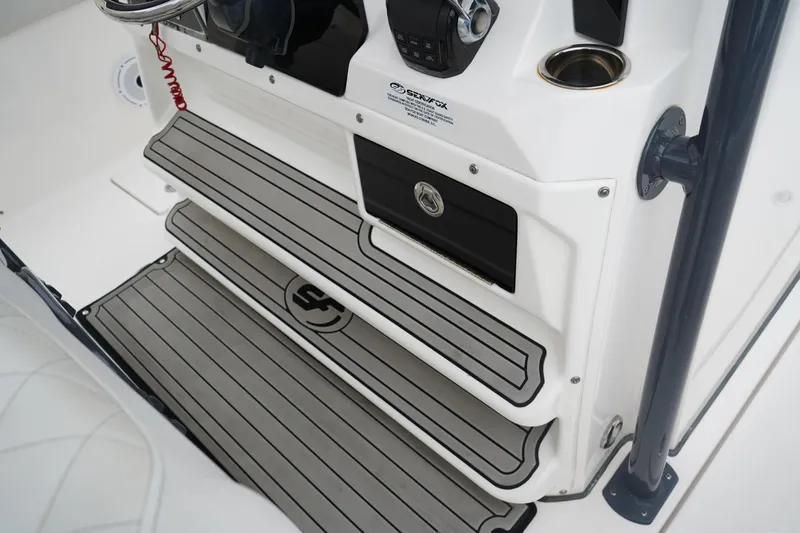 Slide: The Image of 2020 Sea Fox 328 Commander boat interior with non-slip steps and control panel. - 32