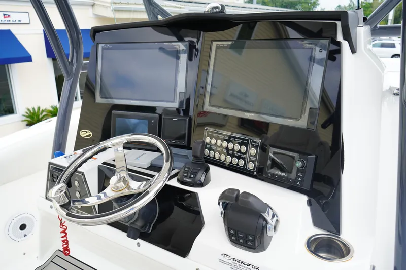 Slide: The Image of 2020 Sea Fox 328 Commander helm with dual screens and advanced controls. - 33